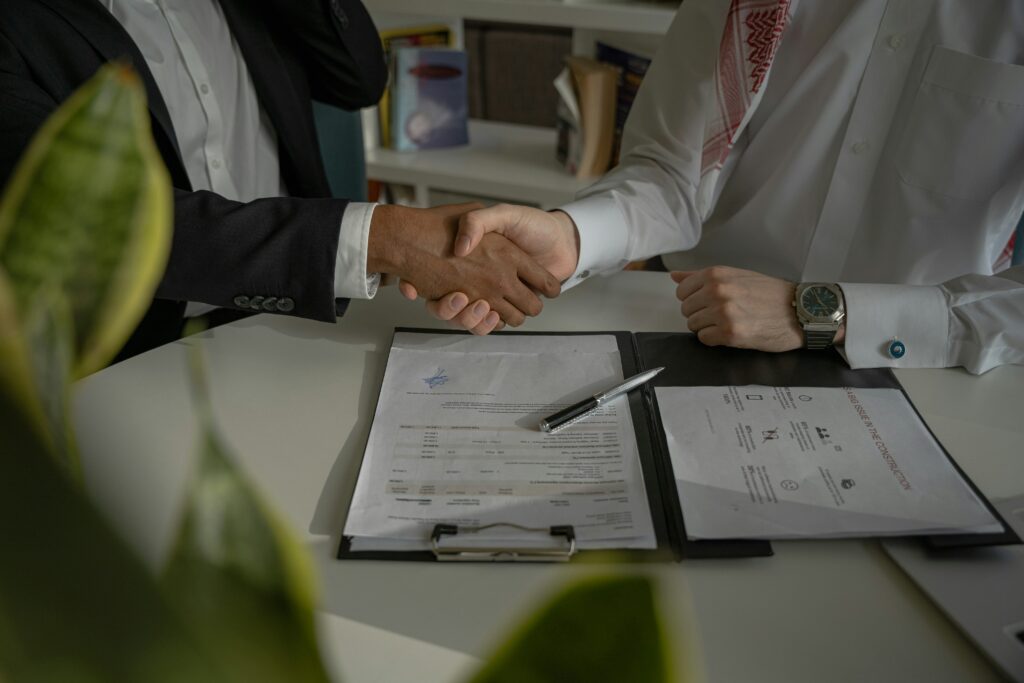 Cosigner and student signing contract/reviewing documents